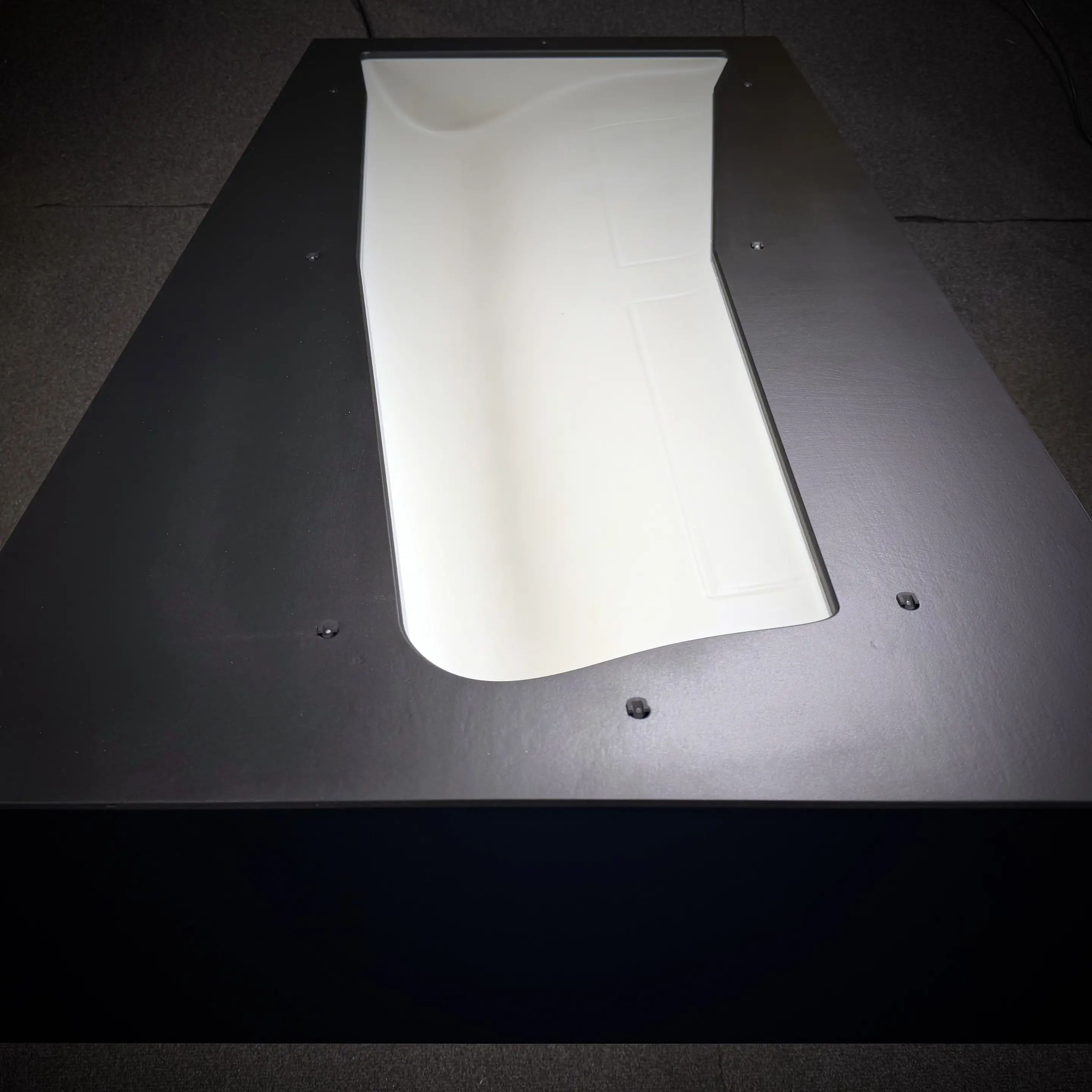 Finished painted CNC-milled wing negative mold in side perspective as a real trade show exhibit