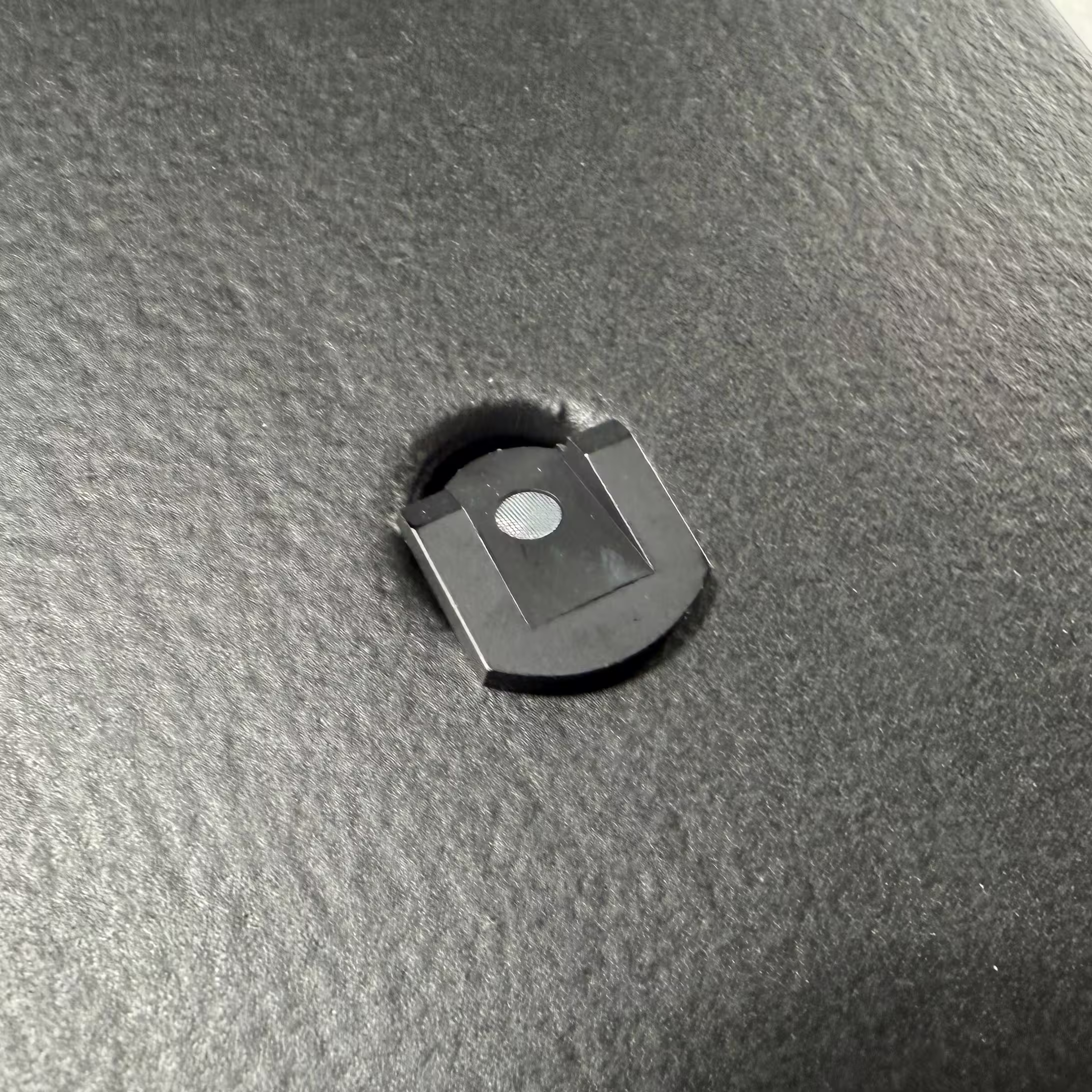 Close-up of a laser reflector on the trade show exhibit for precise alignment of the projection on the mold